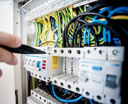 An IT technician working on a device